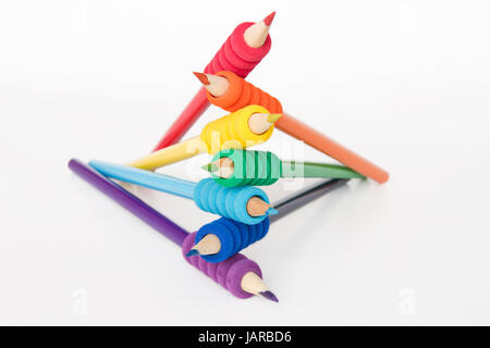 Pencils arranged in color order of the rainbow on white background Stock Photo