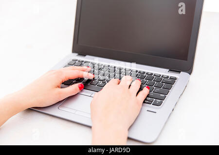 Womans hands on notebook working in clean and bright office, at home, freelance Stock Photo