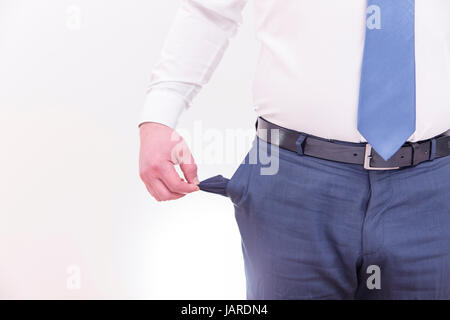 Concept of bankruptcy. Businessman turns out an empty pocket Stock Photo