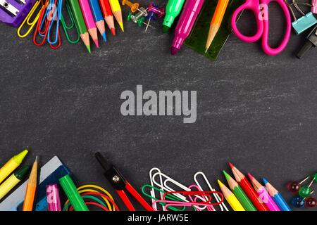 School supplies double border on a chalkboard background Stock Photo