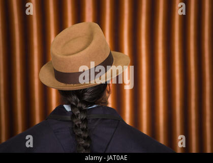 Close up back photo of young man wearing traditional clothes from the highlands in Ecuador, South America Stock Photo