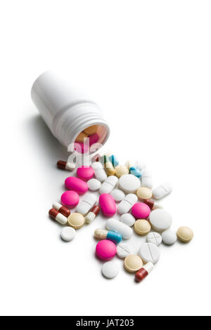 spilled colorful pills from medical bottle Stock Photo