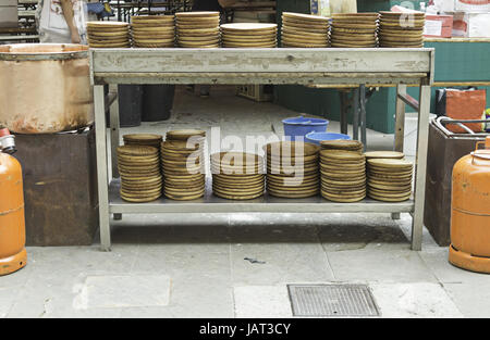 Inside bar with bar and wood tableware, catering and restaurant Stock Photo