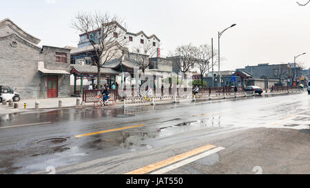 BEIJING, CHINA - MARCH 19, 2017: people and bicycles on Liangshidian street in Dashilanr business area, on south of Tiananmen Square, west of Qianmen  Stock Photo