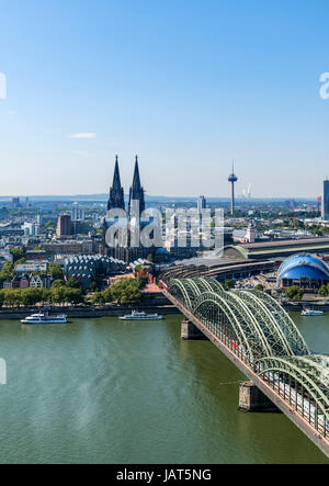 Cologne Cathedral. View over the River Rhine to Cologne Cathedral and Railway Station with the Hohenzollern Bridge in the foreground, Cologne Germany Stock Photo