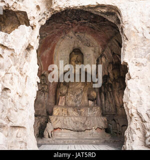 LUOYANG, CHINA - MARCH 20, 2017: Middle Binyang Cave with carved statues in Longmen Grottoes (Longmen Caves). The complex was inscribed upon the UNESC Stock Photo