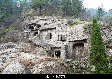 LUOYANG, CHINA - MARCH 20, 2017: caves in West Hill of Chinese Buddhist monument Longmen Grottoes. The complex was inscribed upon the UNESCO World Her Stock Photo