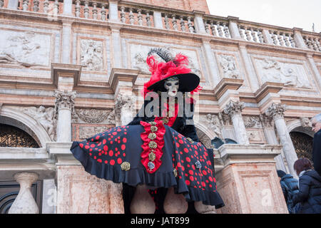 Venezia Veneto Italy Carnival 2010; the masks around venice arrived from europe. Girl dressed up with a classic and colorful costume posing in San Mar Stock Photo