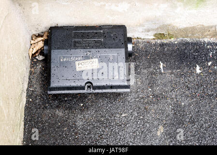 Black plastic rat bait poison box used to control vermin and mice Stock Photo