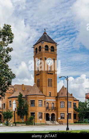 The old Macon County Courthouse located in Tuskegee Alabama, USA.  Made of traditional red brick found in many buildings in the south. Stock Photo