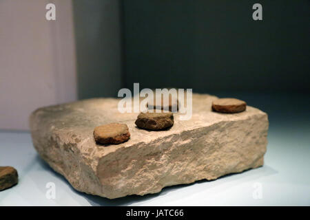 Gaming-Board block of stone. The gaming pieces are made out of shaped fragment of broken pots. From Giza. British Museum. Stock Photo