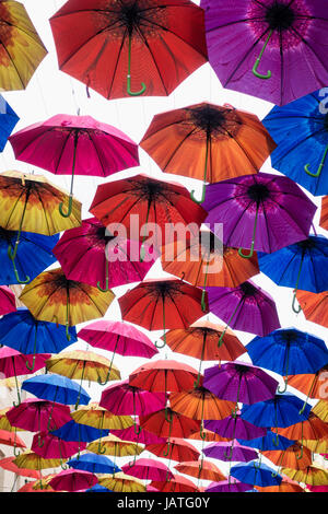 Umbrellas suspended in the air above shoppers in Southgate Shopping Centre, Bath, England, UK Stock Photo