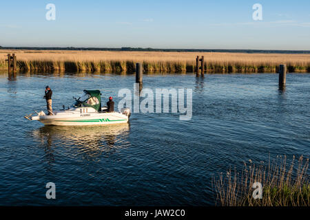 People fishing, small motorboat, Barther Bodden, reed covered waterfront, Baltic Sea, peninsula of Fischland-Darß-Zingst, Zingst, Mecklenburg-Vorpomme Stock Photo