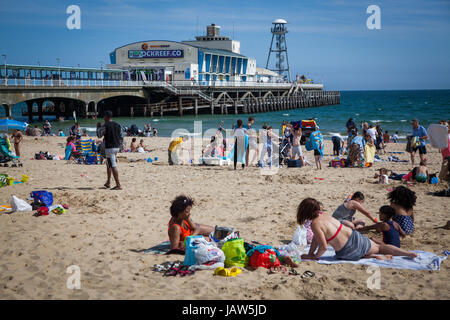 BOURNEMOUTH, UK - 31st MAY, 2017: Unidentified people on Bournemouth Beach and Pier, Dorset, England Stock Photo