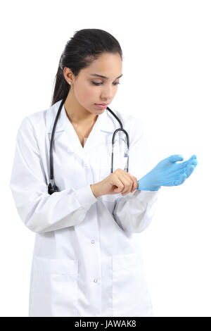 Arab female doctor putting latex gloves isolated on a white background Stock Photo