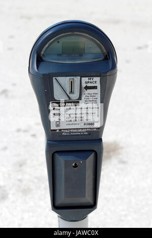 FORT LAUDERDALE, FLORIDA - FEBRUARY 3: One gray metal outdoor urban public parking meter that you pay for parking by coins, city card or pay by phone on February 3, 2013 in Ft Lauderdale, Florida. Stock Photo