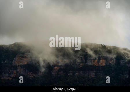 Storm clouds roll over a sandstone plateau. Stock Photo