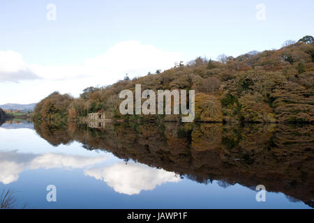 boat house beside the calm river blackwater in county Waterford Ireland Stock Photo