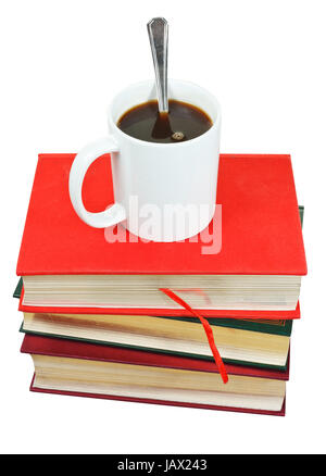 mug of coffee on stack of books isolated on white background Stock Photo