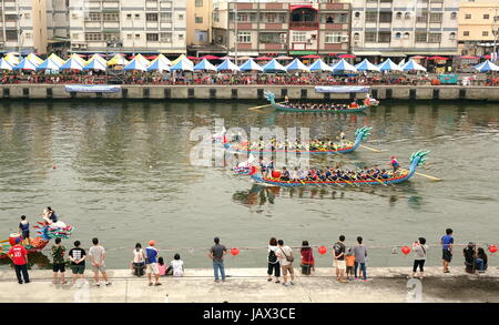 LINYUAN, TAIWAN -- MAY 28, 2017: Two unidentified teams compete in the Dragon Boat Races at Zhongyun Fishing Port in Taiwan. Stock Photo