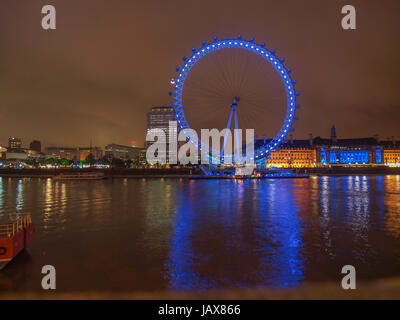 LONDON, ENGLAND, UK - JUNE 18, 2011: Night view of the London Eye ferris wheel on the South Bank of River Thames aka Millennium Wheel built in 1999 using advanced aeronautical engineering know how by British Airways Stock Photo