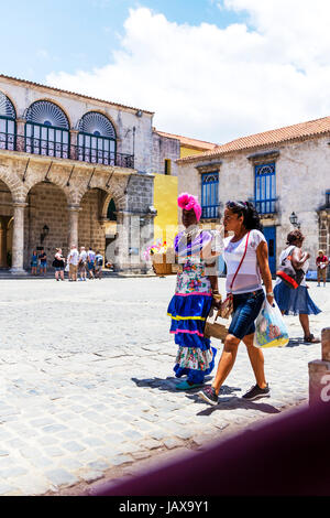 Cuban woman wearing traditional costume in the Plaza de la Catedral, Old Havana, Havana, Cuba, Cuban woman traditional dress Stock Photo