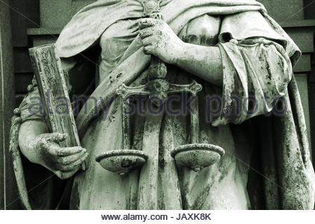 Scales of justice in the hands of Justitia as a symbol of equality