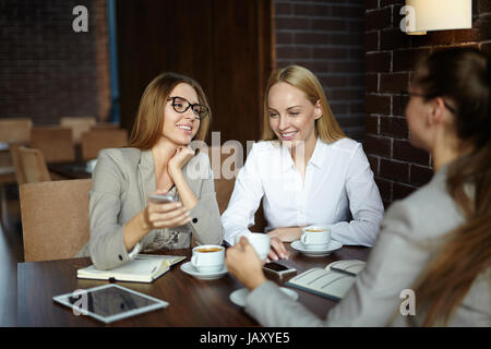 Having Project Discussion in Cafe Stock Photo