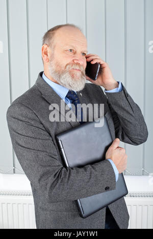 Picture of a confident businessman having a phone call Stock Photo