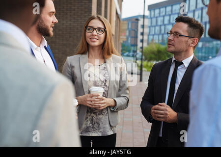 Chatting with Colleagues Outdoors Stock Photo