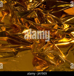 full frame creased gold foil background Stock Photo