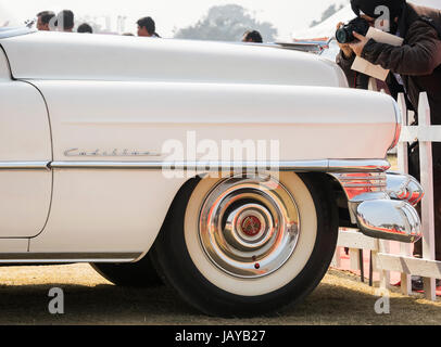 New Delhi, India - February 6, 2016: Classic oldtimer Cadillac Series 62 2-door convertible vintage car in white color on display at Red Fort, New Del Stock Photo