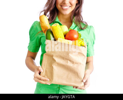 Image of paper packet full of different kinds of food held by smiling female Stock Photo