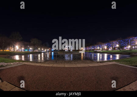 The artificial lake called Swan Pond in the Kadriorg park in Tallinn, Estonia, is quite a place to see in the winter nights. The Christmas lights on t Stock Photo