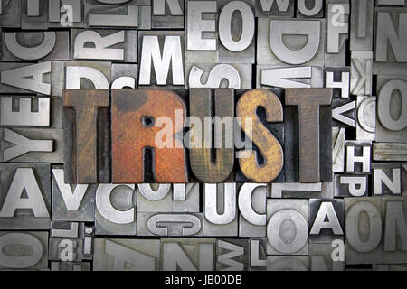 Trust written in vintage letterpress type Stock Photo