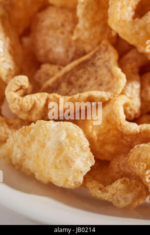 a bowl of fried pork skins Stock Photo