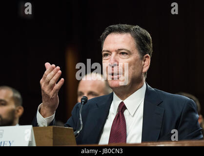 Washington DC, June 8, 2017, USA: Former FBI Director James Comey, testifies at the Senate Intelligence Committee about his conversations with President Donald J Trump regarding Michael Flynn, the former White House Security Director. Comey tried to warn Trump about Flynn's connections to the Russians. Comey said that Trump asked him to curtail any FBI investigations involving Flynn.  Patsy Lynch/MediaPunch Stock Photo
