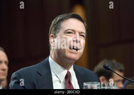 Former FBI Director, James Comey testifies on Capitol Hill about his conversation with President Donald J Trump. Comey said that Trump tried to encourage him and the FBI to minimize or end the investigation of former WH security advisor, Michael Flynn who lied about his meeting with Russian officials before becoming the WH Security advisor.  Trump had fired Flynn for lying. Stock Photo