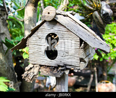 Old wooden birdhouse Stock Photo