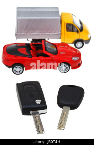 above view of two vehicle keys and truck model isolated on white ...