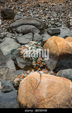 Discarded Fishing Nets washed up on South China Sea Beach, Hong Kong, China Stock Photo