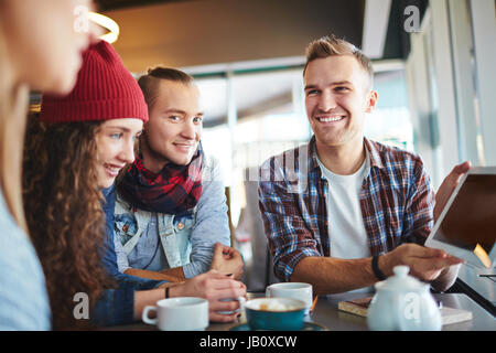 Cheerful Colleagues Wrapped up in Work Stock Photo