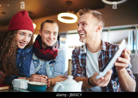 Having Fun with Friends in Cafe Stock Photo