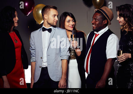 Entertaining Friends with Funny Story Stock Photo