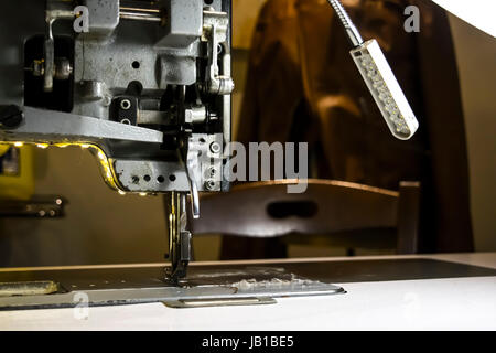 Old sewing machine on factory Stock Photo