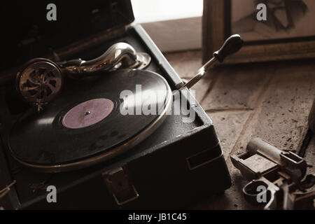 Vintage portable wind-up gramophone, close up photo with selective focus Stock Photo