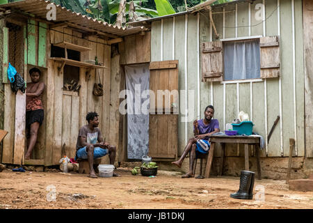 SAO TOME AND PRINCIPE. Black woman at the market, in front of a huge