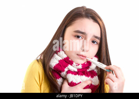 A young girl is sick and having her temperature taken. Stock Photo