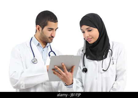 Saudi arab doctors diagnosing looking a medical history isolated on a white background Stock Photo