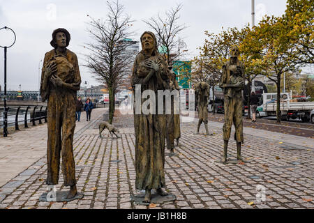 The Famine Sculptures created by Rowan Gillespie in 1997 and situated on Custom House Quay on the banks of the River Liffey, Dublin, Ireland. Stock Photo